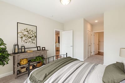 Well-decorated resident bedroom in a senior living apartment