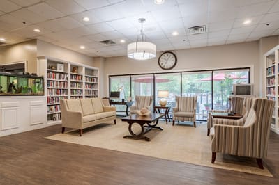 Common area with comfortable seating and bookshelves