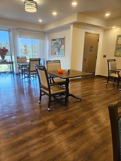 Dining area with chairs and a table, bright interior
