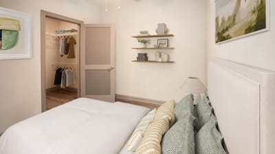 Cozy interior of a resident room with a bed and clothes closet