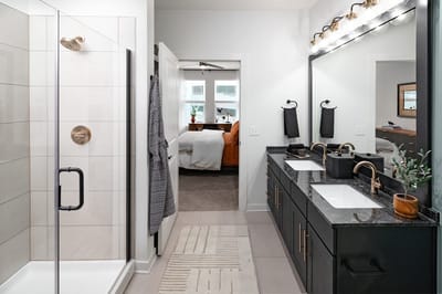 Modern bathroom with dual sinks and shower