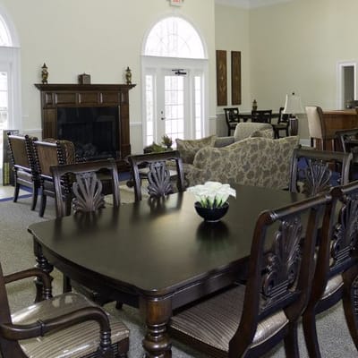 Bright interior view of a living room with tables and seating