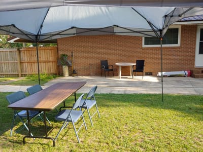 Outdoor seating area with tables and chairs