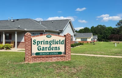Exterior view of Springfield Gardens sign and building