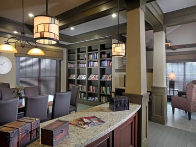 Interior view of a common area with bookshelves and seating