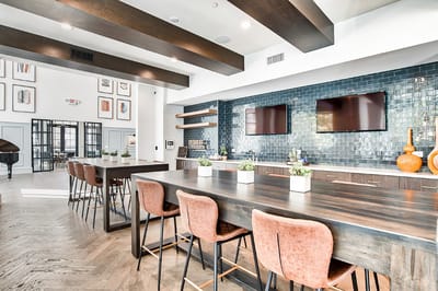 Bright common area with wooden bar and modern decor