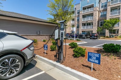 Electric vehicle charging station in the parking area