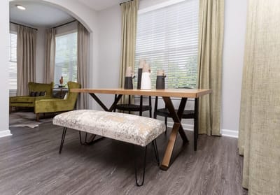 A dining area with modern furniture and decor