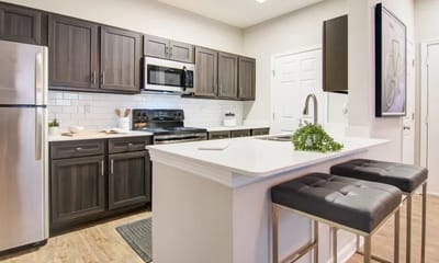 Modern kitchen interior with appliances and seating