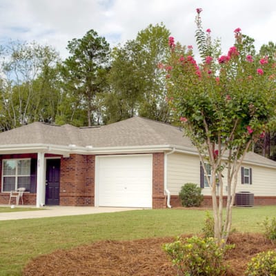 Exterior view of a residential building with landscaping
