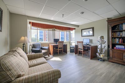 Bright common area with seating and computers