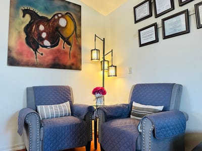 Cozy seating area with modern artwork on the wall