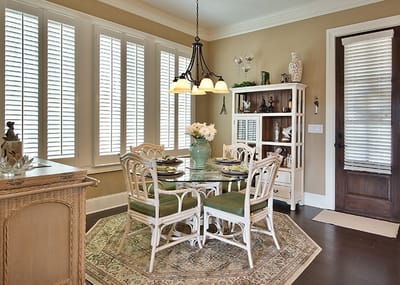 Cozy dining room with a table set for meals