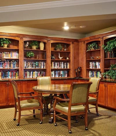 Cozy reading area with bookshelves in the senior living facility