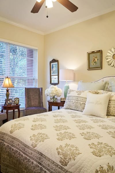 Cozy resident room with decorated bed and lighting
