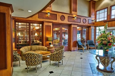 Interior of a common area with seating and bookshelves