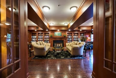 Cozy common area with comfortable seating and bookshelves