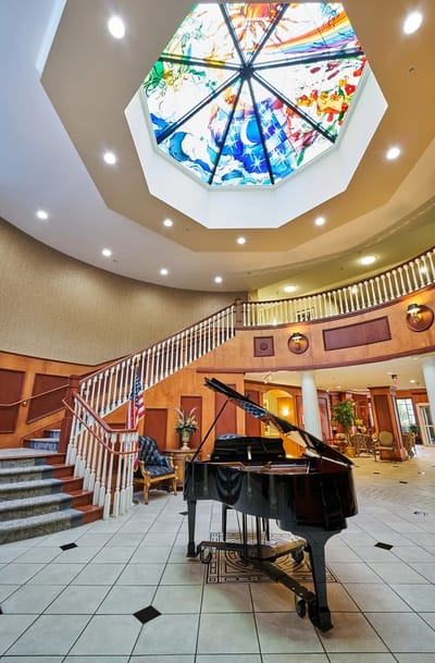 Interior view of a bright lobby with a piano