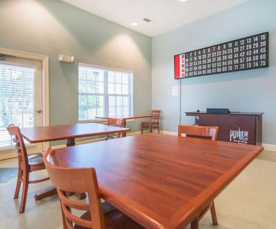 Interior view of a game room area with bingo board and tables