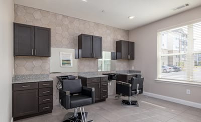 Modern beauty salon area with styling chairs
