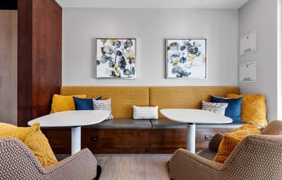 Cozy common area with seating and decorative art