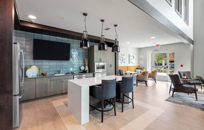 Bright common area with modern kitchen and seating