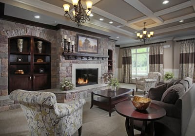 Cozy common area with stone fireplace and comfortable seating