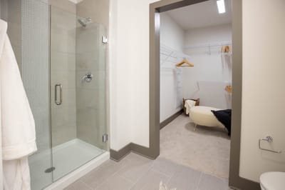 Interior view of a bathroom and closet area