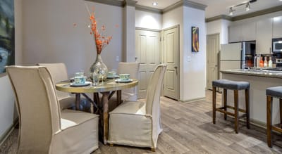 Stylish dining area with table and chairs in a modern interior