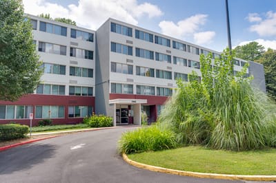 Exterior view of Lenox Summit Apartments with greenery