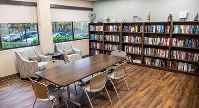 Cozy common area with bookshelves and seating