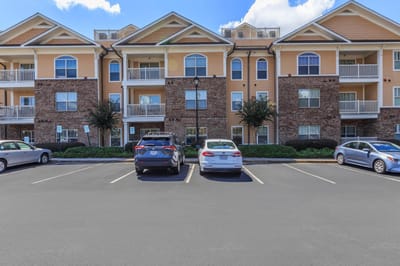 Exterior view of Galleria Manor facilities with parking