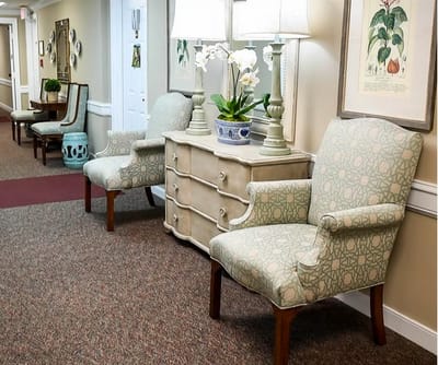 Interior hallway with chairs and decorative items