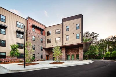 Exterior view of The Ashbury facility with landscaped entry