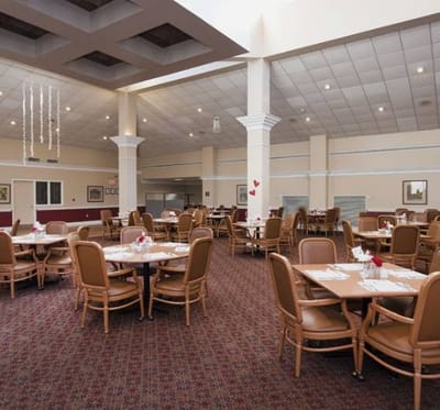 Bright dining room with tables set for meals