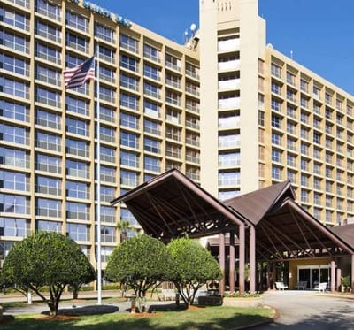 Exterior view of Concordia Village building with gardens