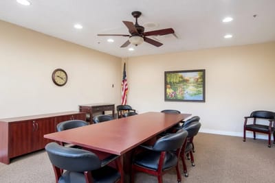 Bright meeting room with a long table and chairs