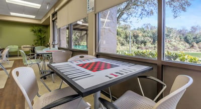Interior common area with a checkers table and seating