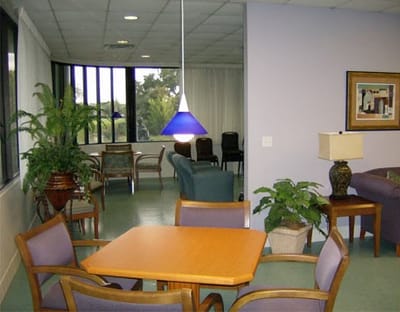 Bright common area with seating and plants