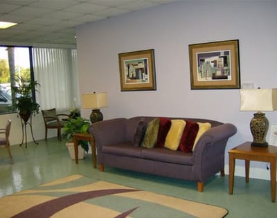 Cozy common area with seating and decorative art