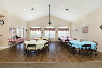 Interior of a common area with tables and decorations