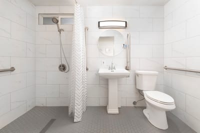Accessible bathroom with grab bars and modern fixtures