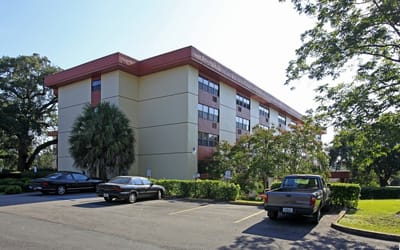 Exterior view of Casa Calderon facility with parking area