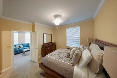 Well-furnished bedroom in a senior living facility