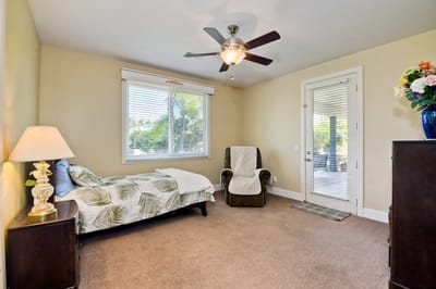 Private resident room with chair and bed