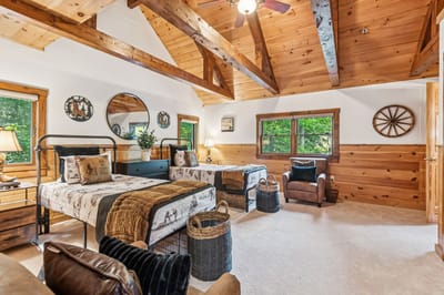 Cozy shared bedroom with wooden decor and two beds