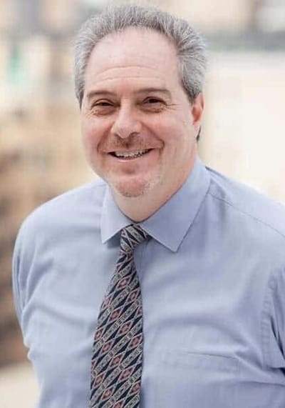 Smiling staff member in professional attire
