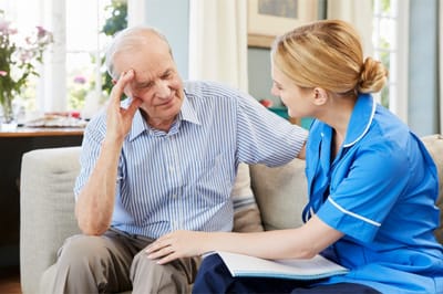 Caregiver interacting with a senior resident.