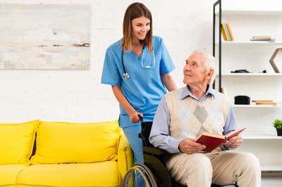 Healthcare worker assists an elderly resident indoors.