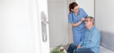 Healthcare worker assisting a resident
